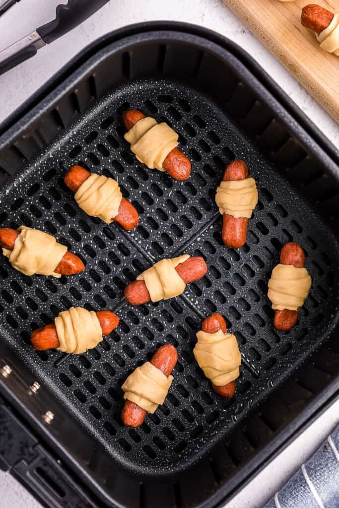 Pigs in a Blanket in an air fryer basket