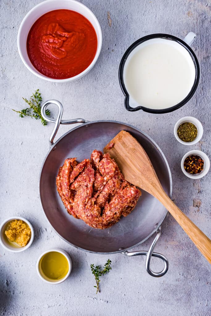 Skillet with Italian Sausage in it