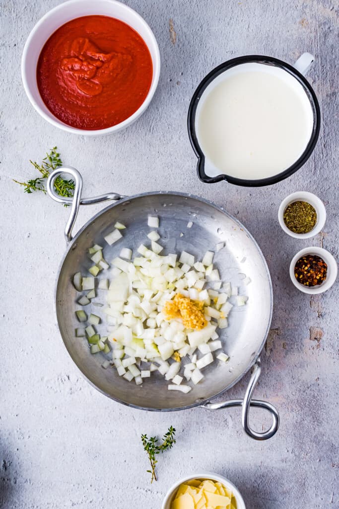 Skillet with onions and garlic in it