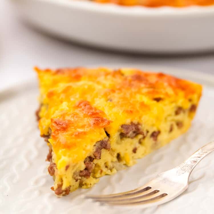 Slice of cheeseburger pie on white plate