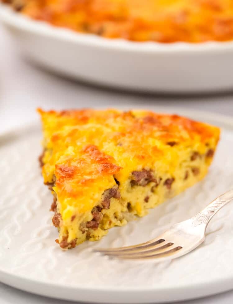 Slice of cheeseburger pie on white plate