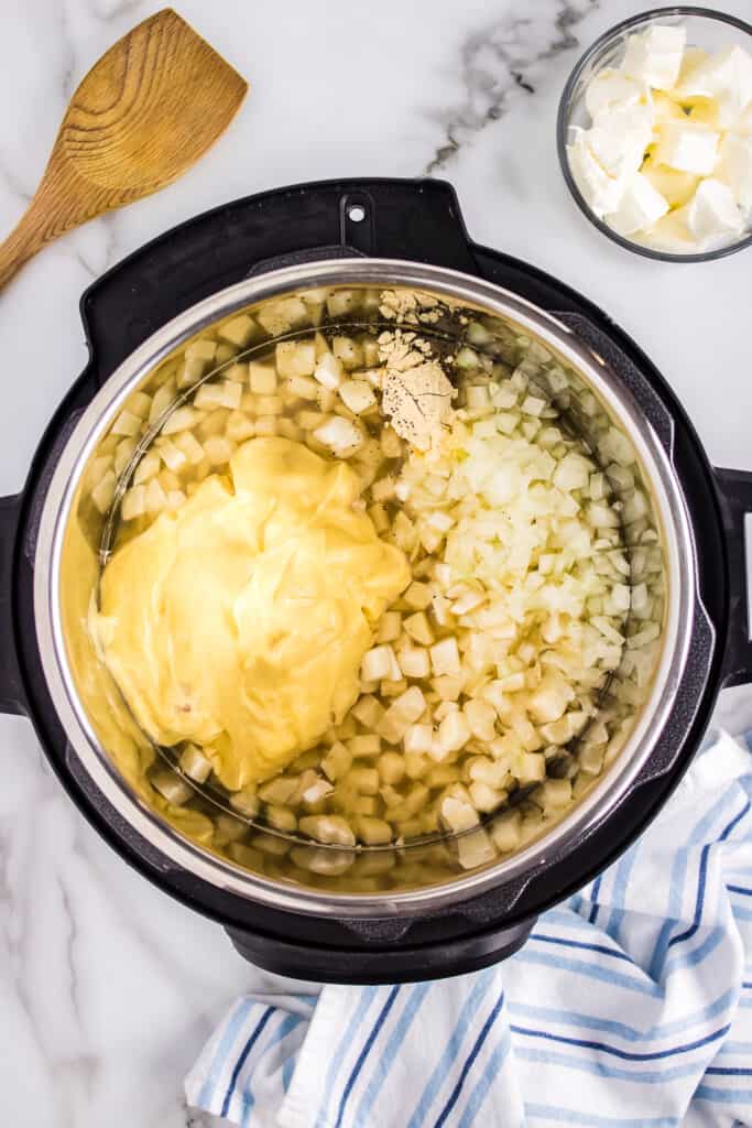 Instant Pot with ingredients for potato soup