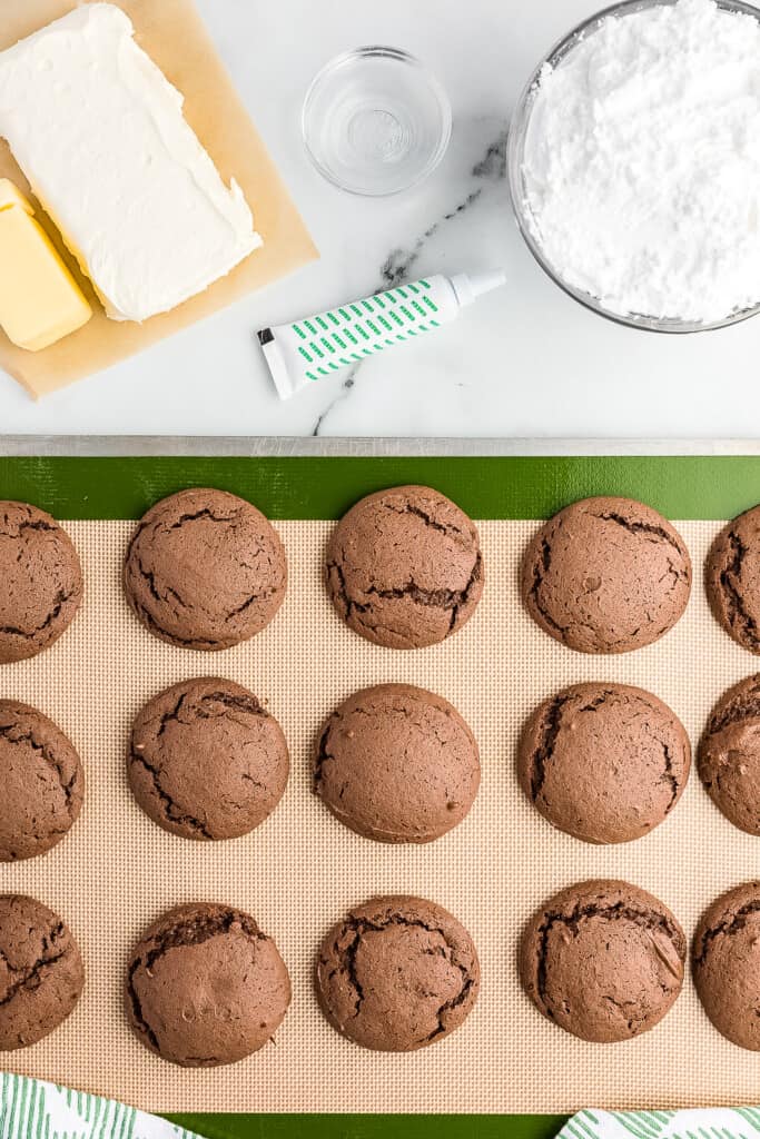 Sheet pan with baked chocolate cookies on it