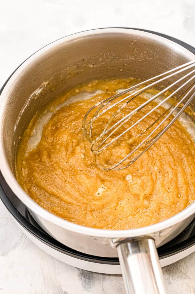 Saucepan whisking melted butter and flour