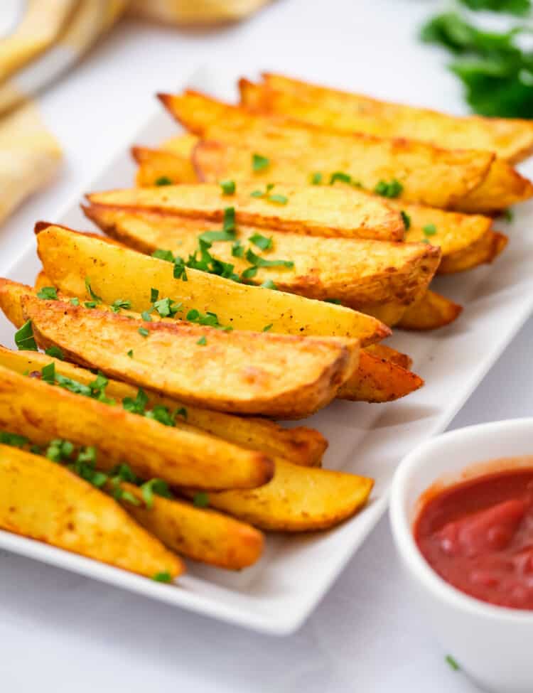 White platter with air fryer potato wedges