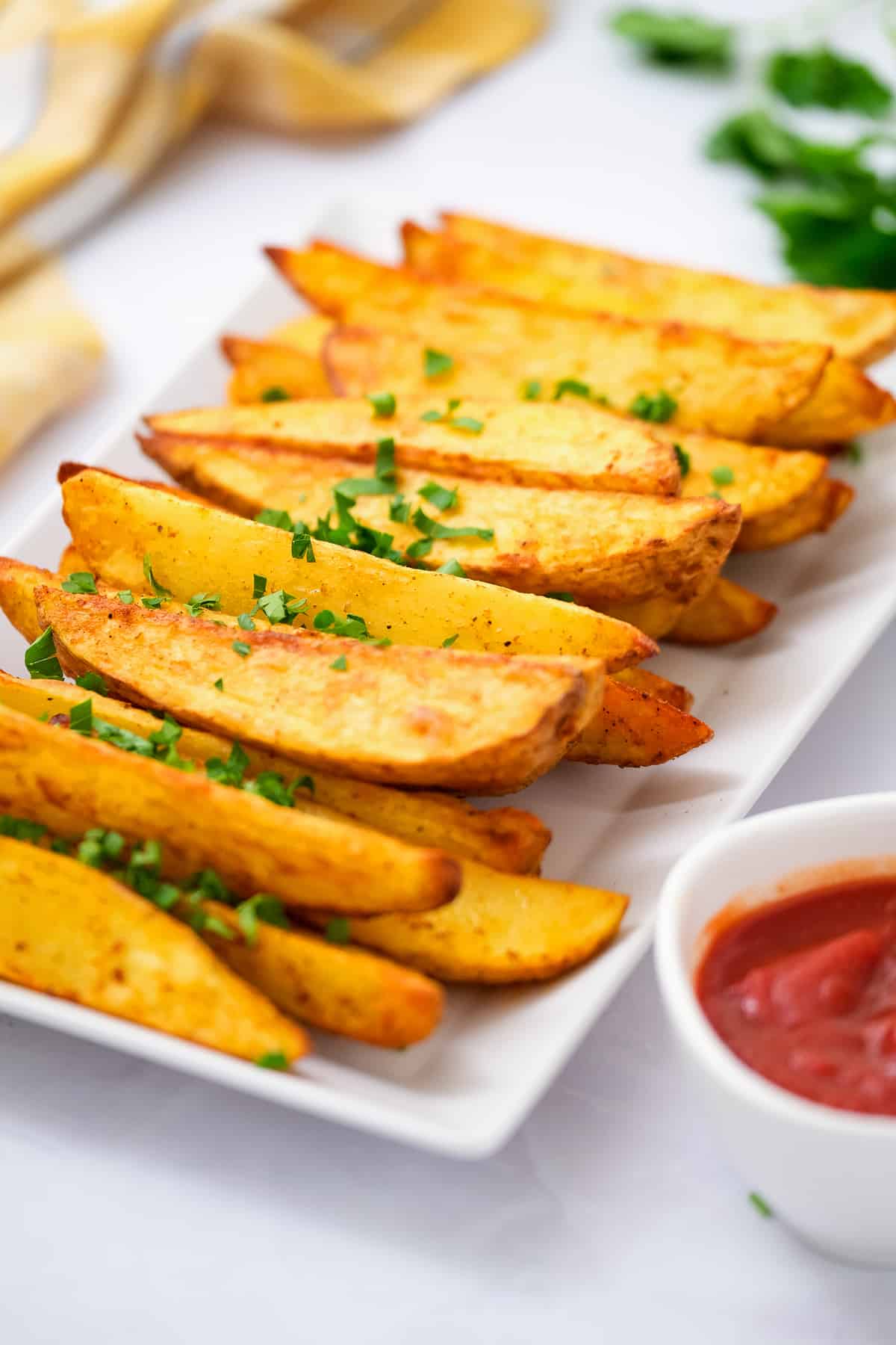 White platter with air fryer potato wedges