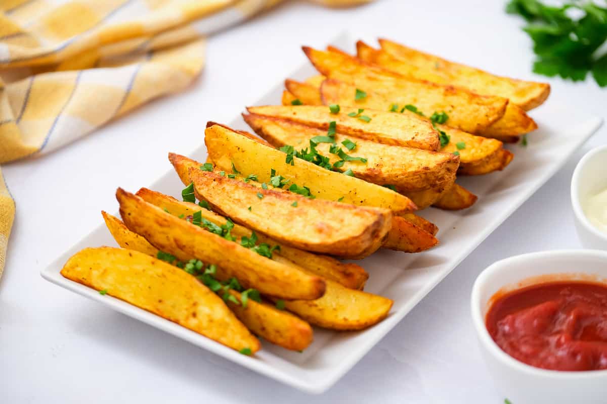 Potato Wedges on white platter