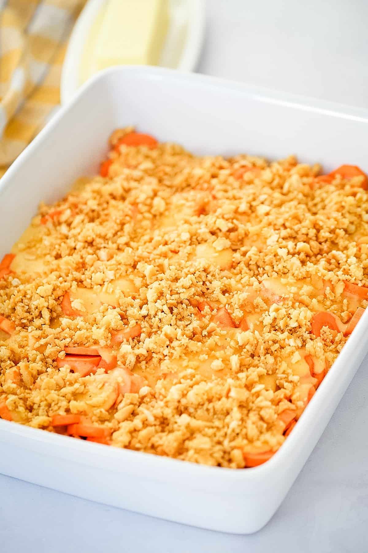 Baking dish with cheesy carrots in it