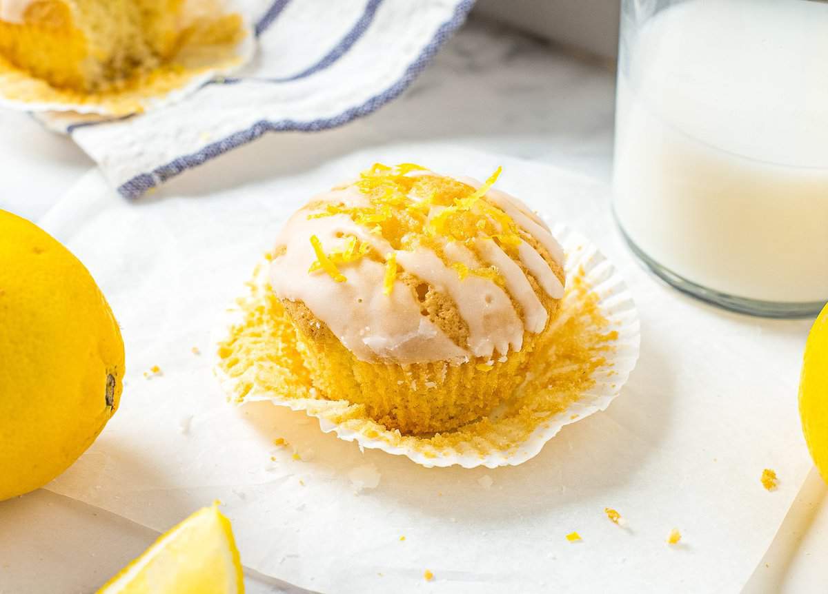 Glazed Lemon Muffin sitting on muffin liner