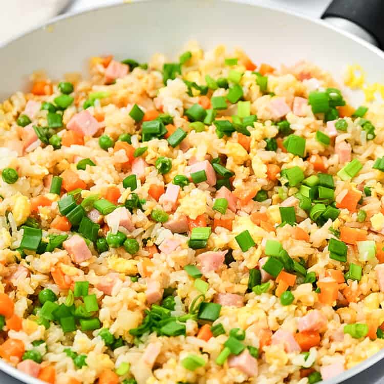 Skillet with ham fried rice in it