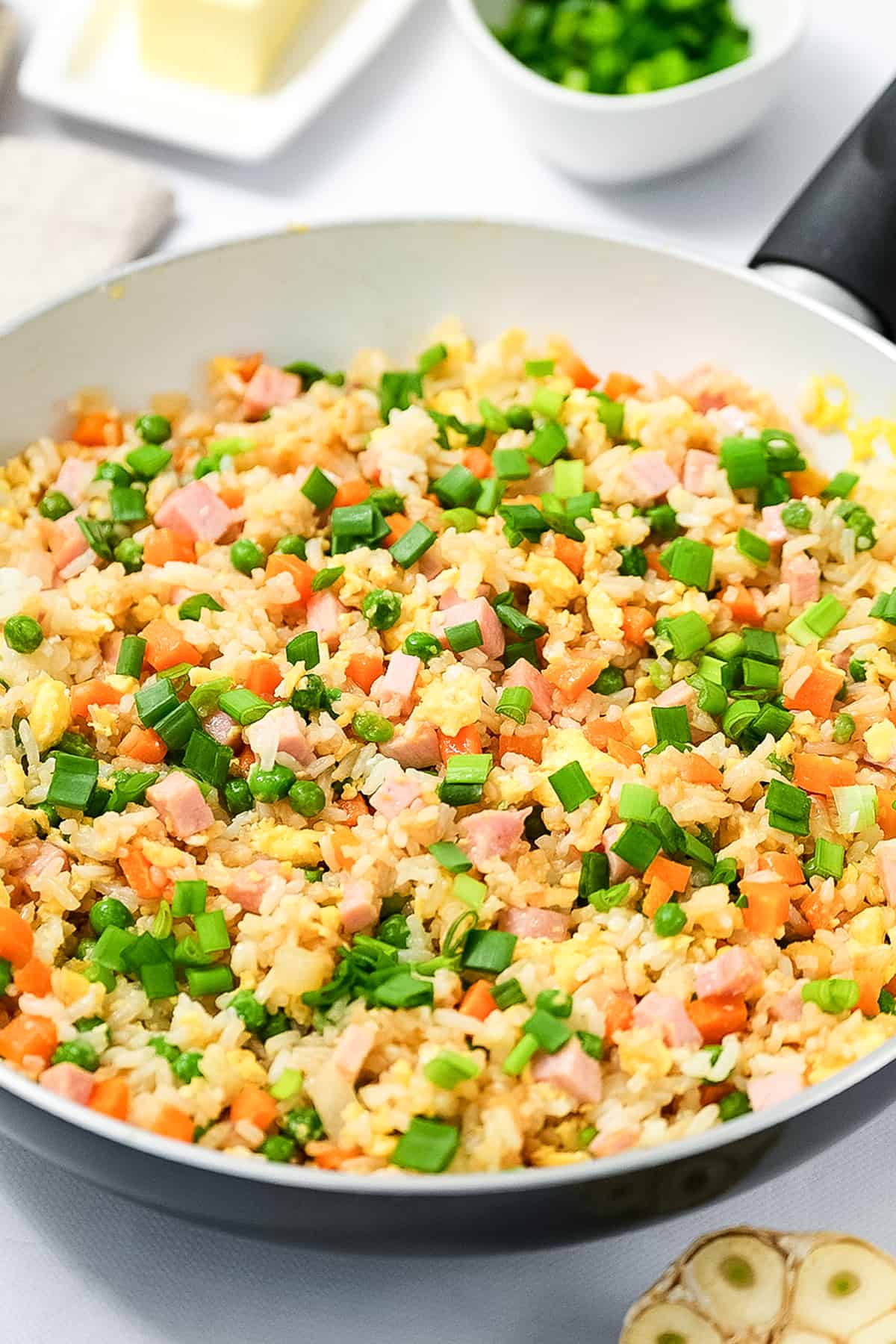 Skillet with ham fried rice in it