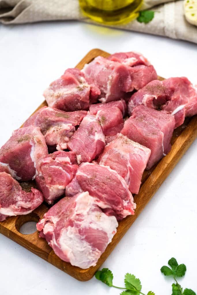 Pork Should cut into cubes on cutting board