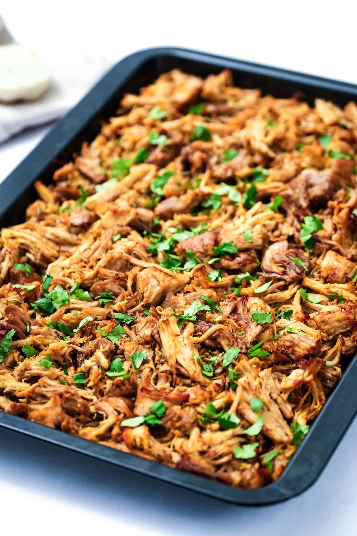 Instant Pot Carnitas broiled with chopped cilantro on top