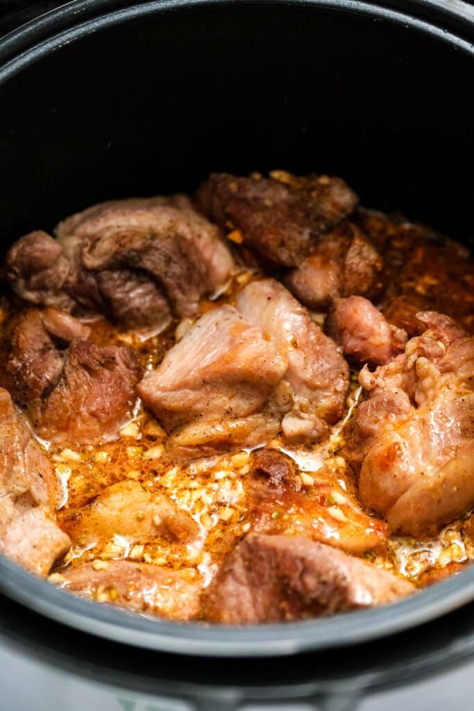 Instant Pot with cooked Pork shoulder in it