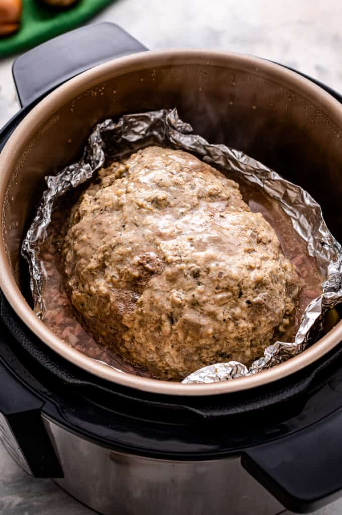 Instant Pot with cooked meatloaf