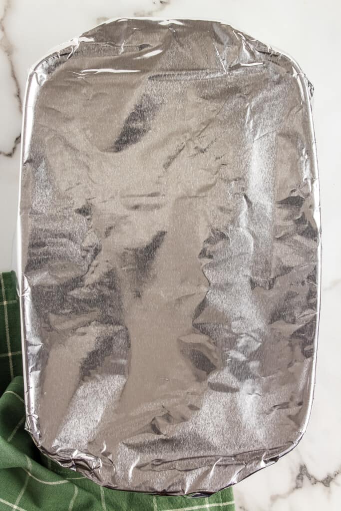 Casserole dish covered with aluminum foil