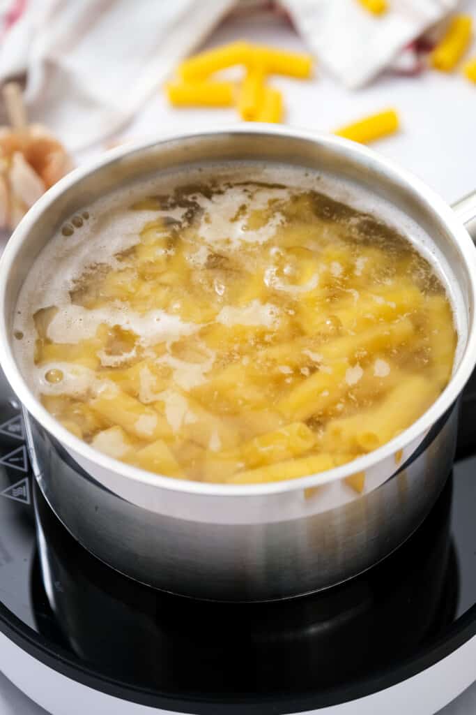 Saucepan with boiling rigatoni noodles