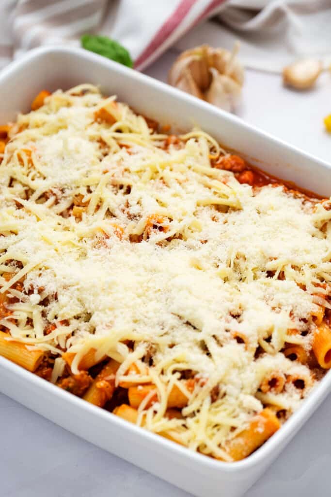 Rigatoni casserole in white dish before baking