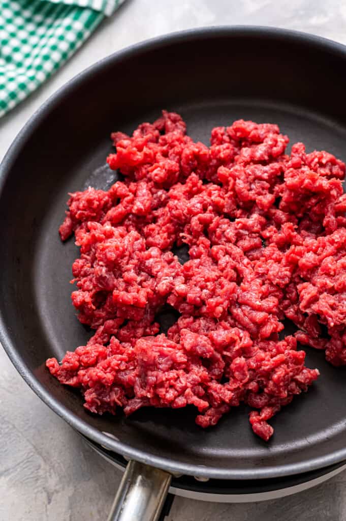 Skillet with raw ground beef