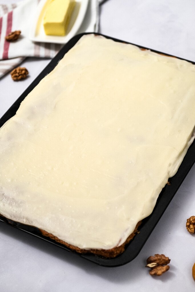 Carrot Cake Bars in pan with cream cheese frosting