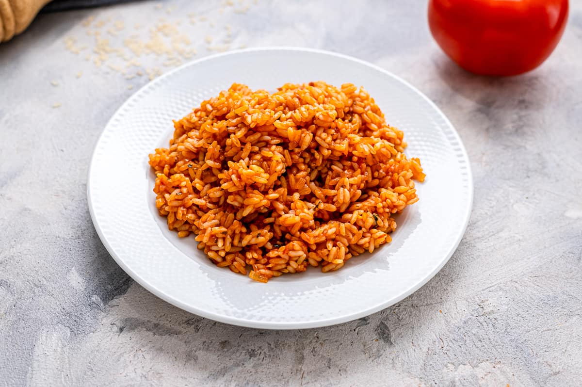 White plate with Spanish rice on it