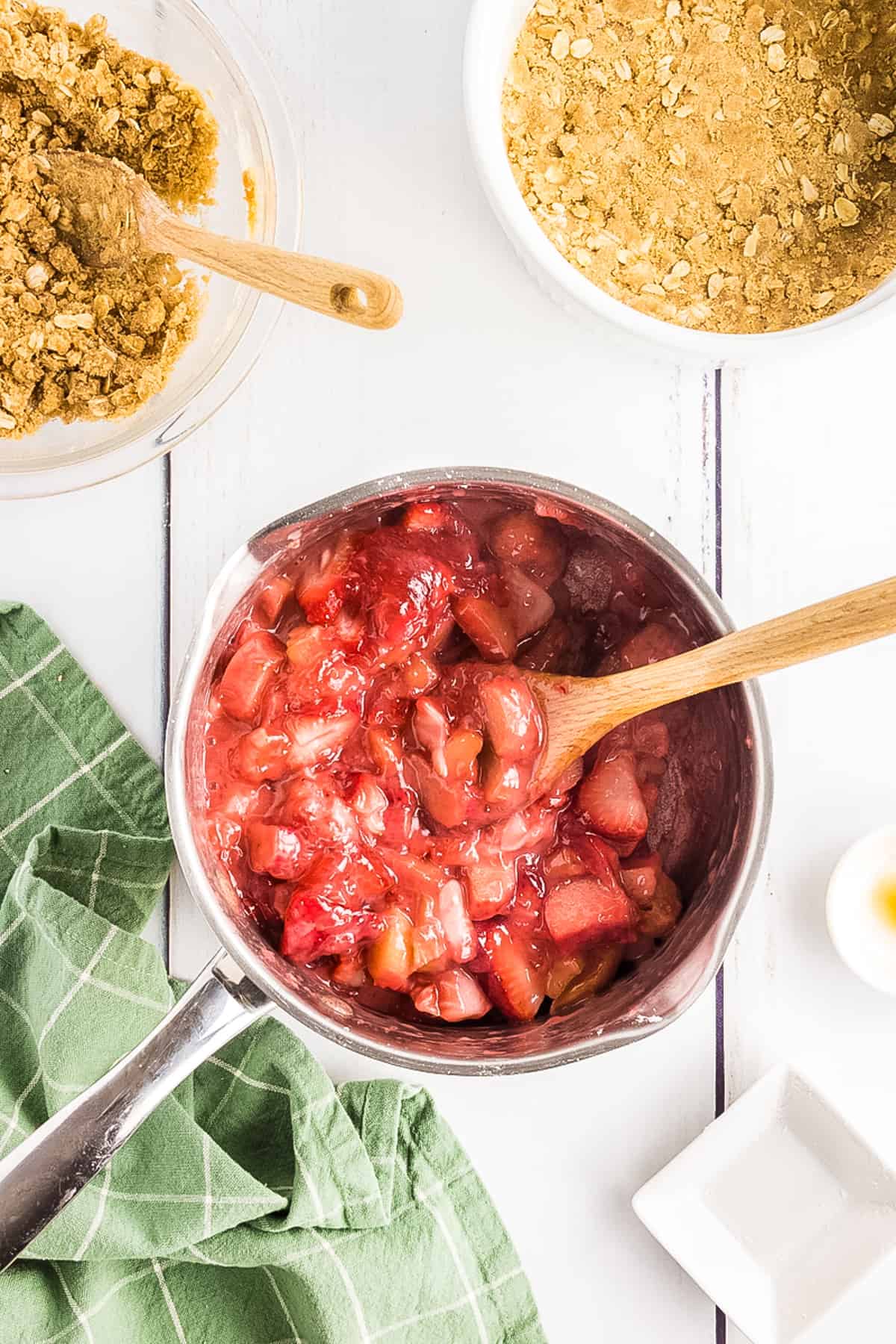 Saucepan with cooked rhubarb and strawberry filling