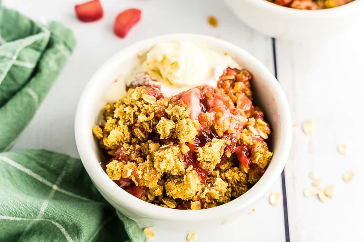 Strawberry Rhubarb Crisp in bowl with ice cream