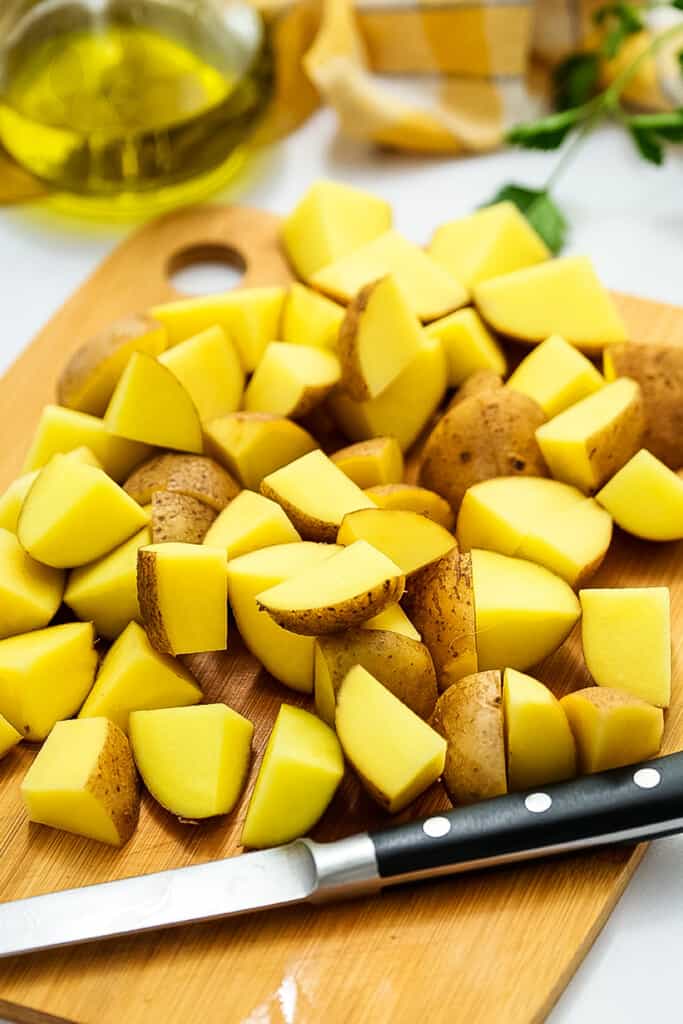 Chopped potatoes on cutting board