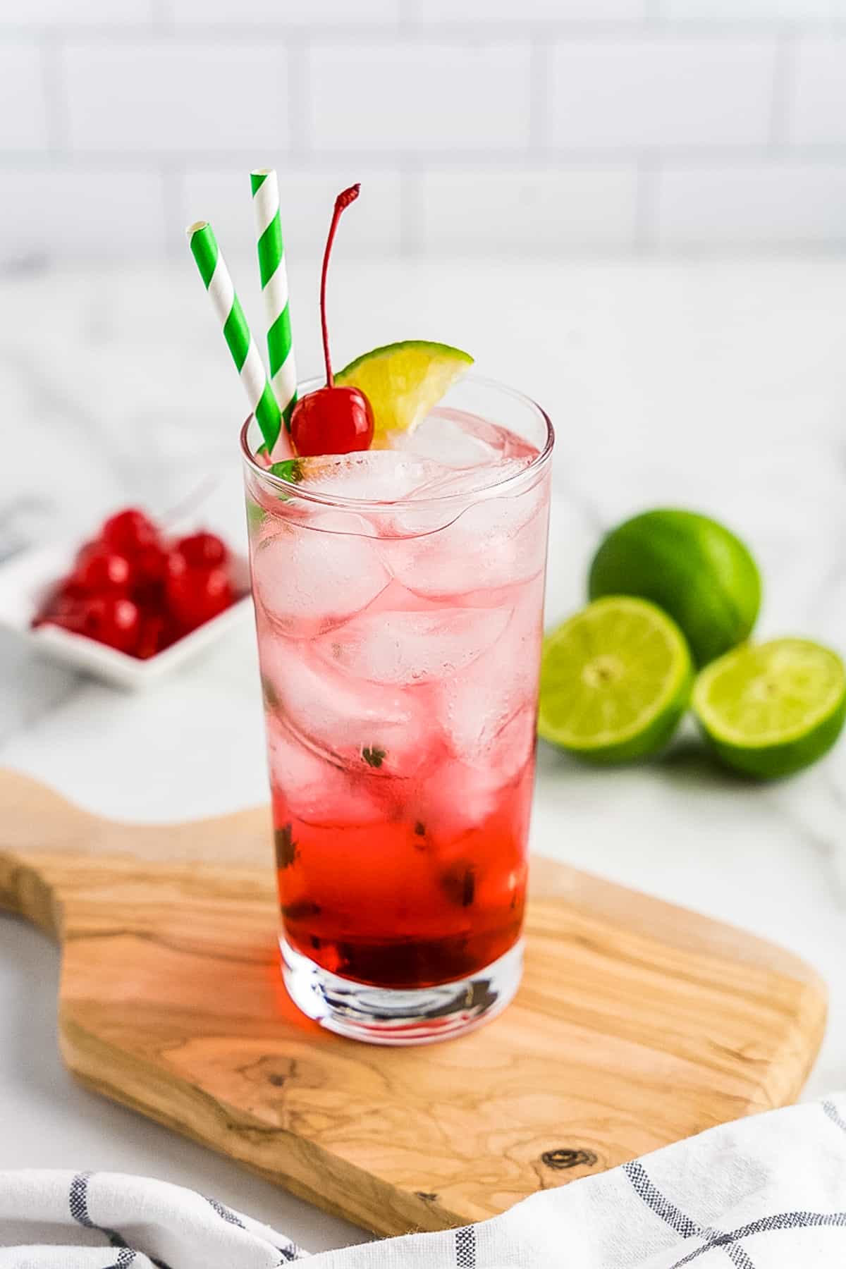 Wood cutting board with a Dirty Shirley cocktail