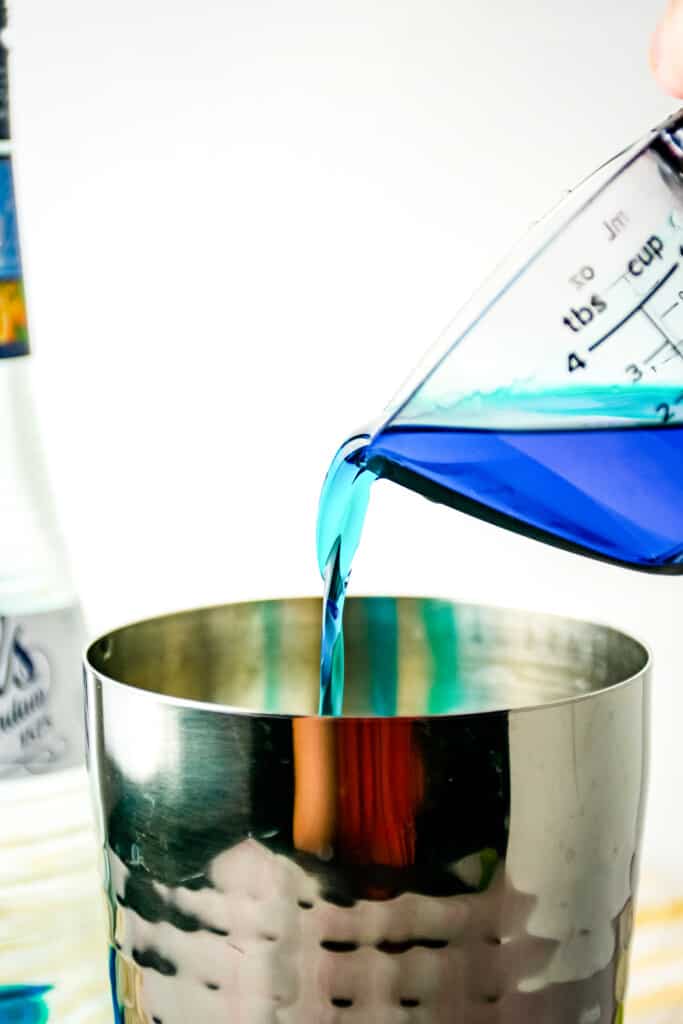 Adding blue curacao to cocktail shaker