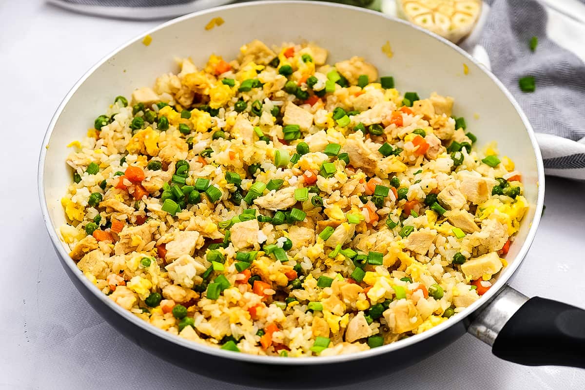 Skillet with prepared chicken fried rice