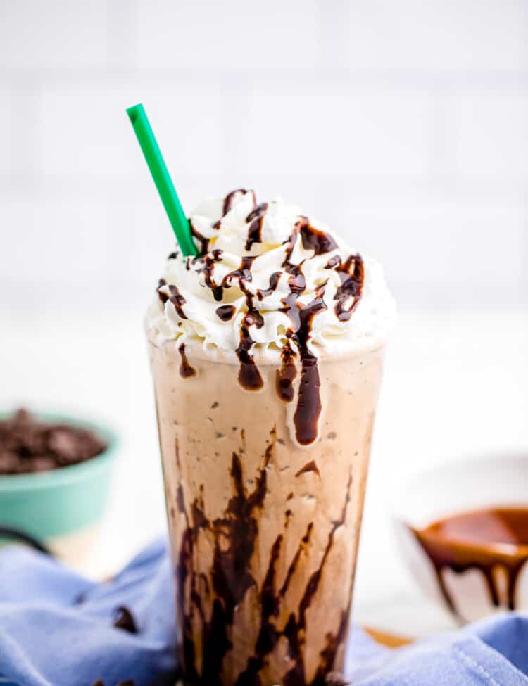 Java Chip Frappuccino in glass with whipped cream and straw