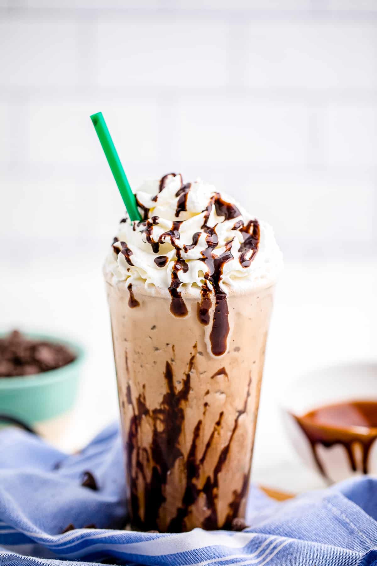 Java Chip Frappuccino  in glass with whipped cream and straw