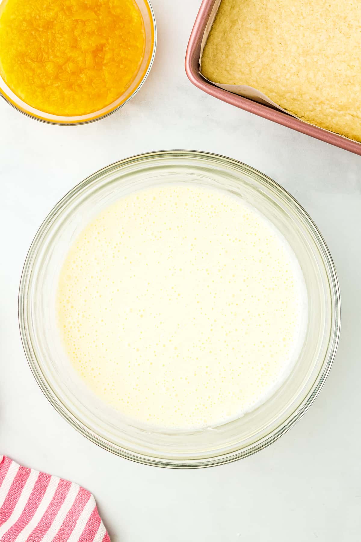 Cheesecake filling in mixing bowl