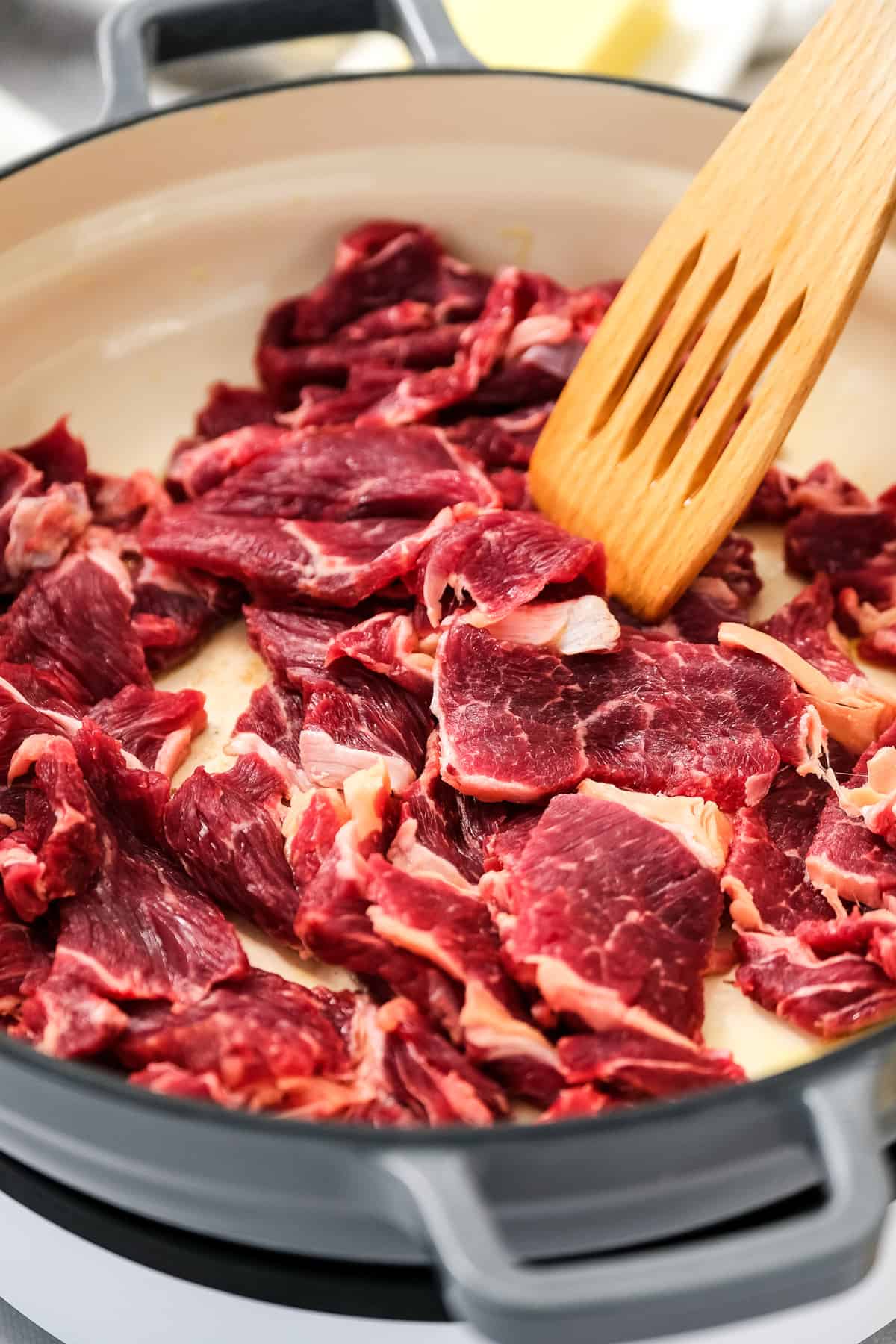 Thinly cute ribeye steak in skillet