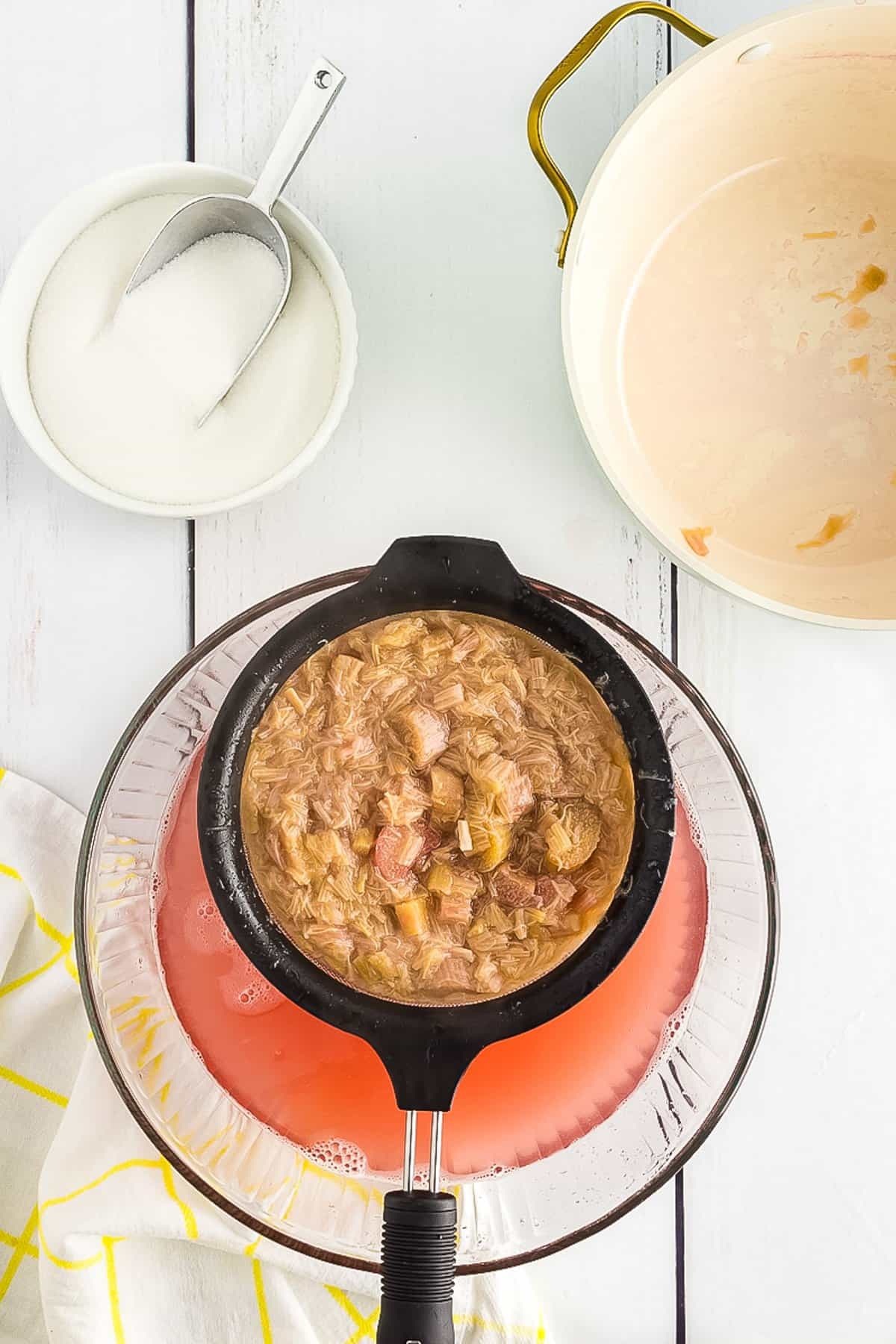 Straining cooked rhubarb