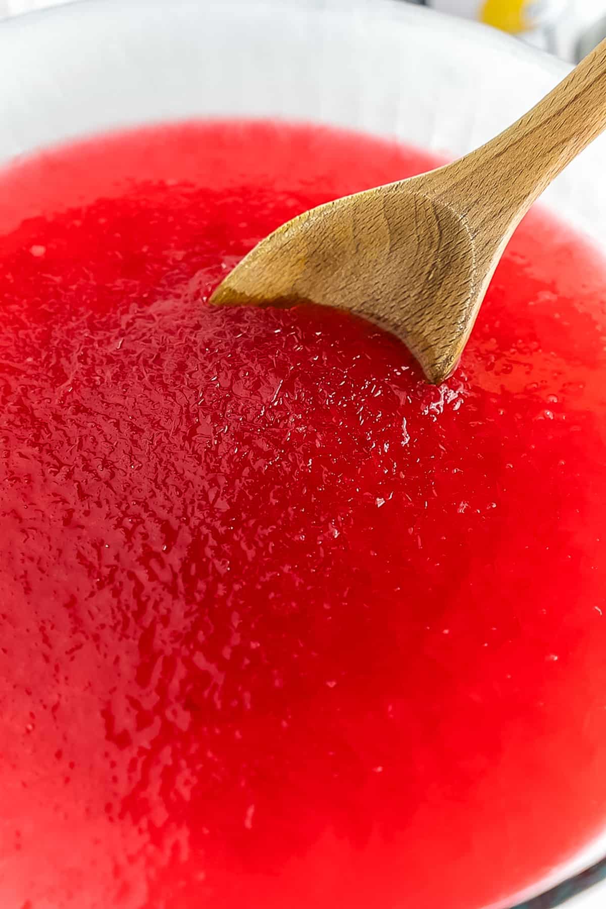 Stirring slush in glass bowl