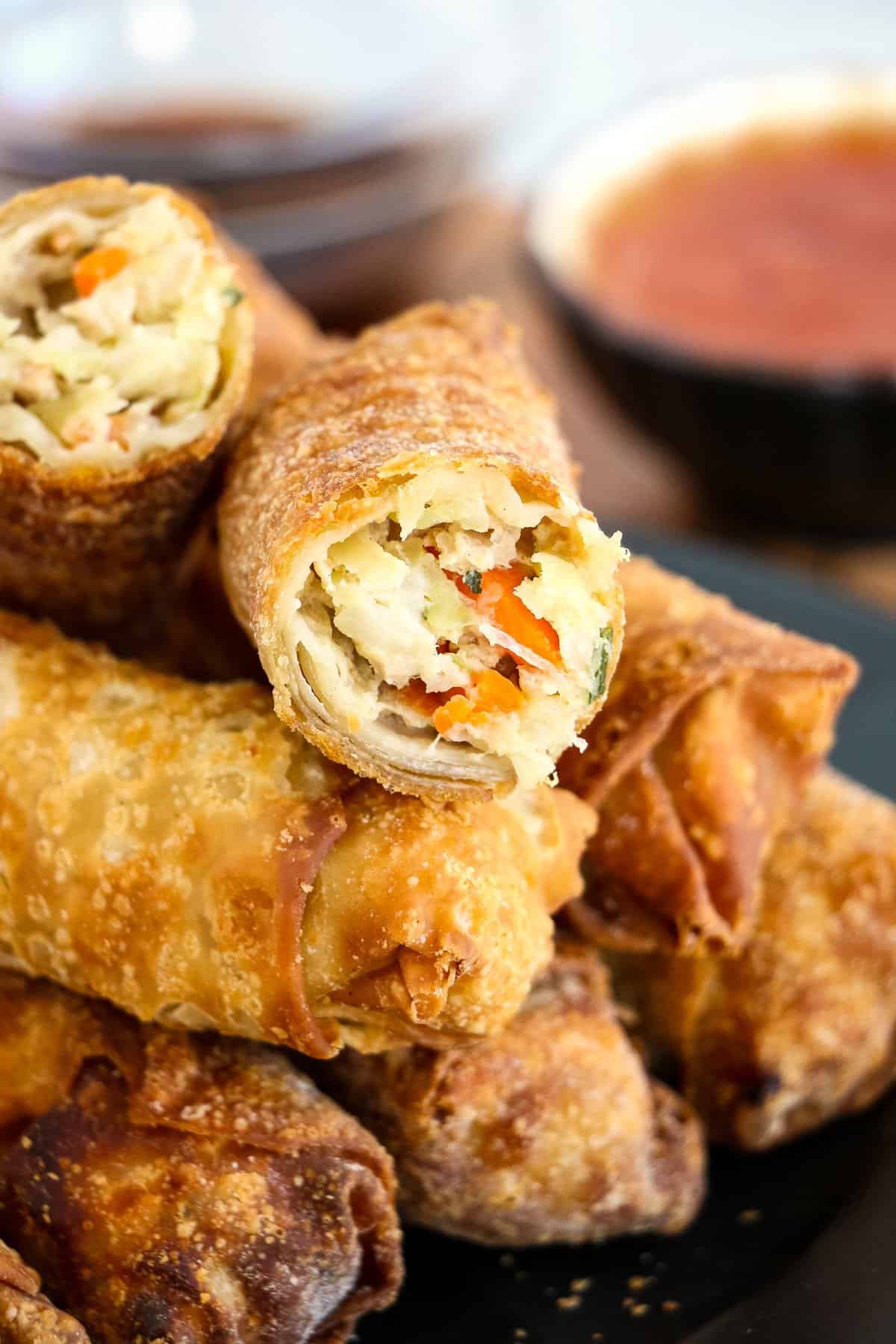 Egg Rolls in stack with one cut open