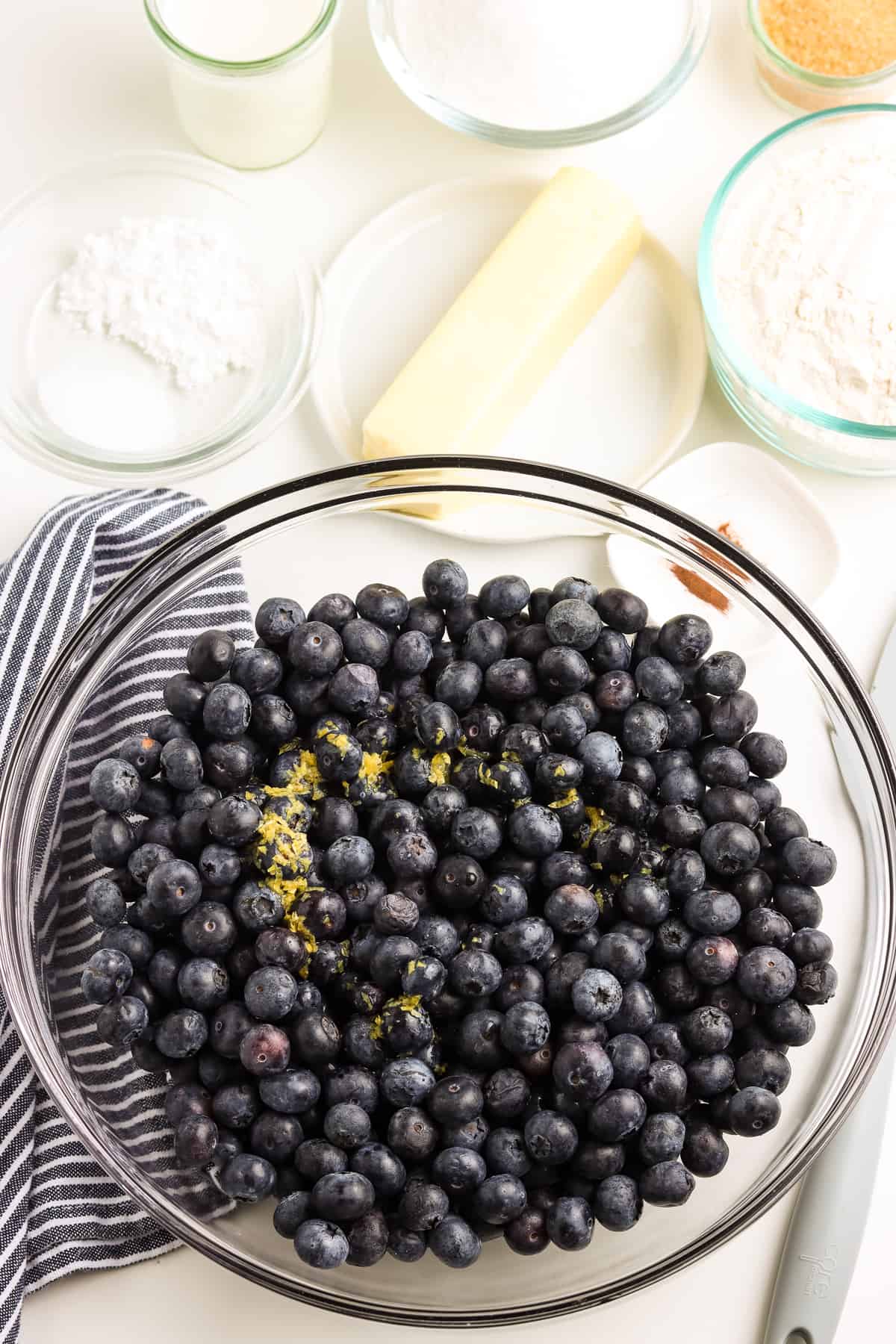 Bowl with blueberries and lemon zest.