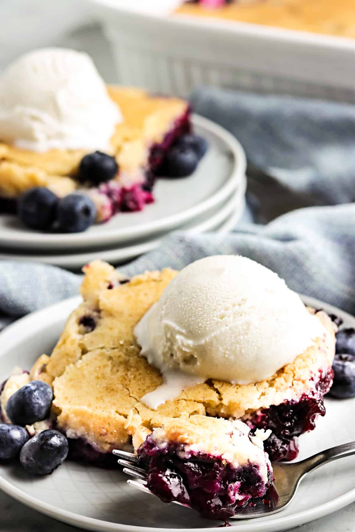 Blueberry cobbler with ice cream on plate