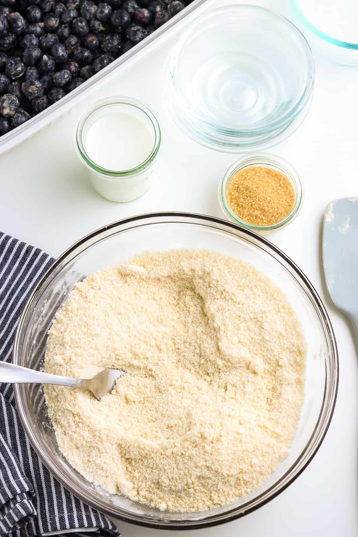 bowl of butter cut into flour.