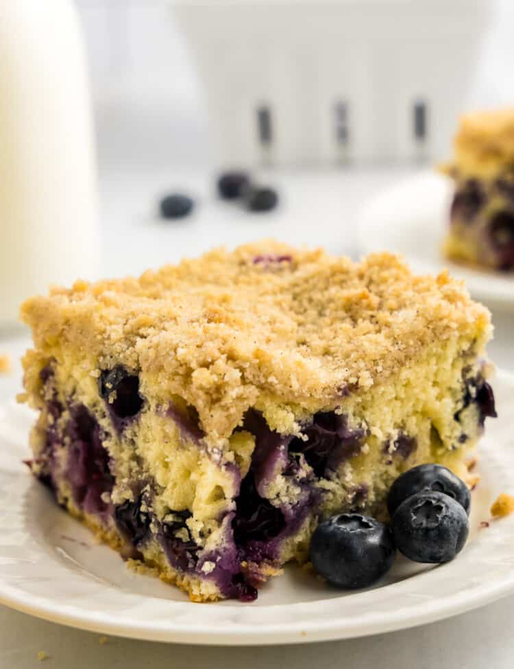 Slice of blueberry coffee cake on plate