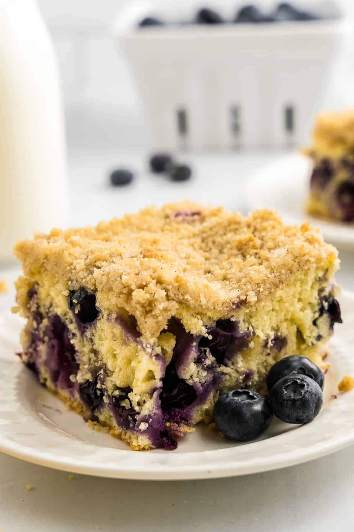 Slice of blueberry coffee cake on plate