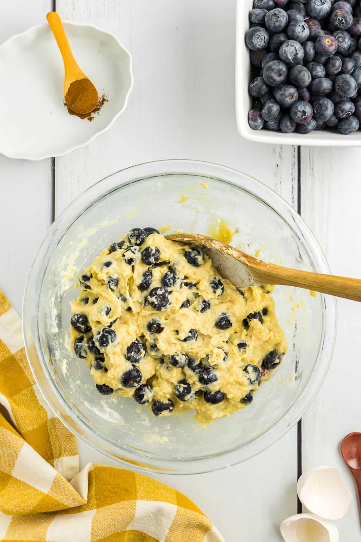 Glass bowl with blueberry coffee cake batter