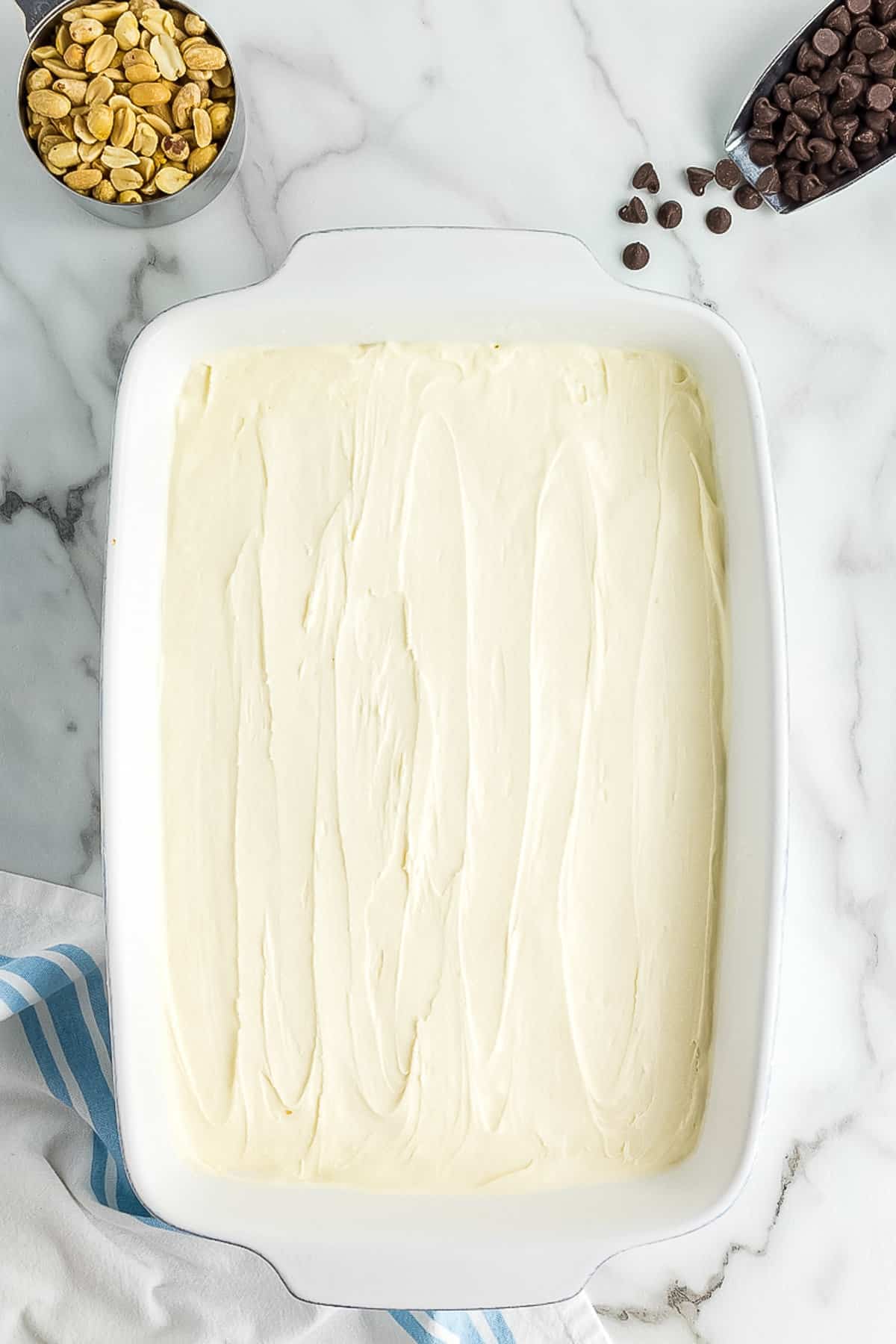 White Casserole dish with a layer of vanilla ice cream