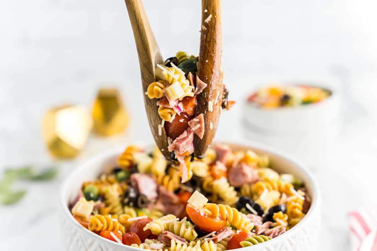 Spoons holding pasta salad
