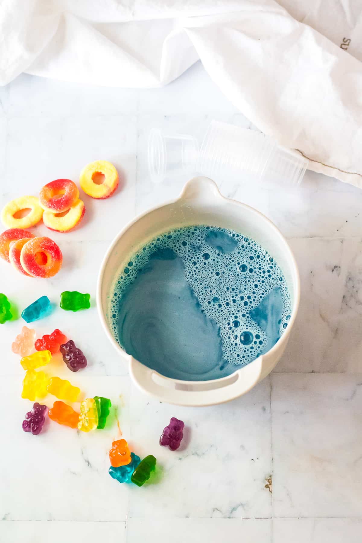 Overhead image of blue jello mixed in bowl