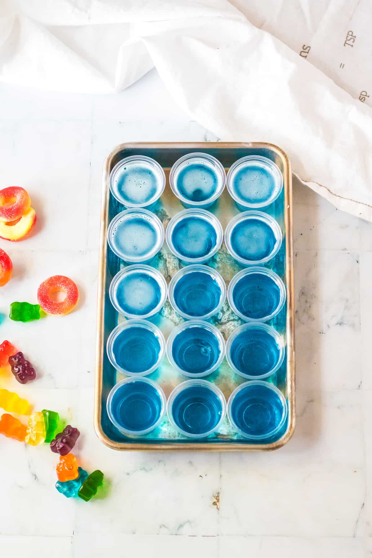 Small cups filled with blue jello mixture