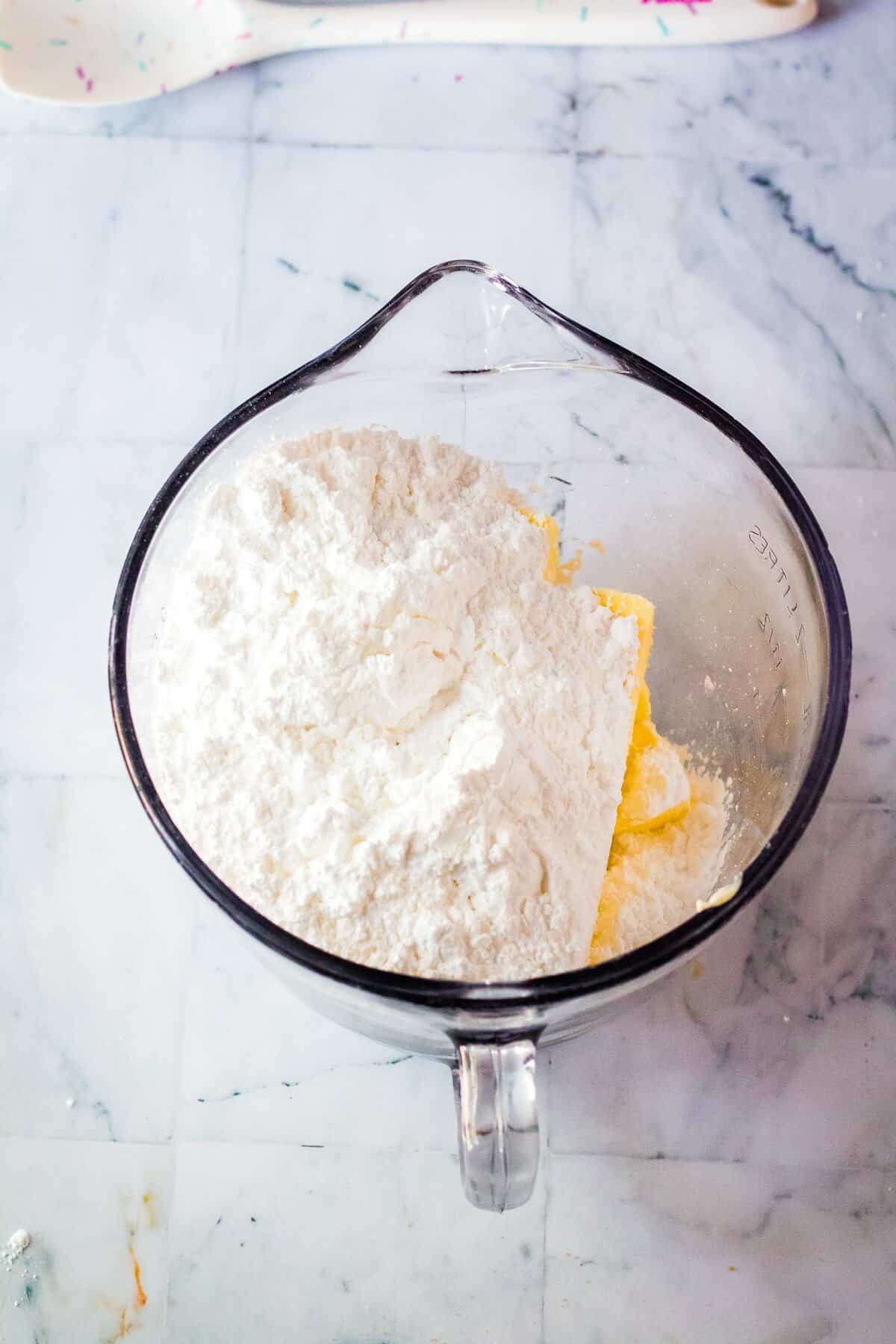 Ingredients in glass bowl for buttercream frosting