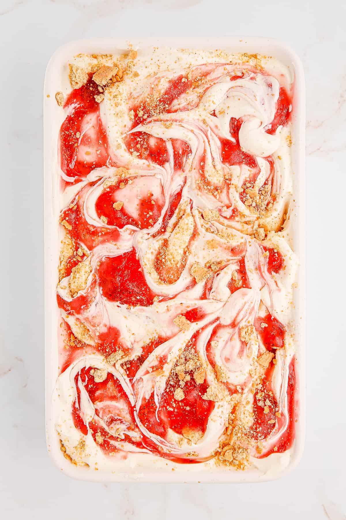 Overhead image of strawberry cheesecake ice cream in loaf pan